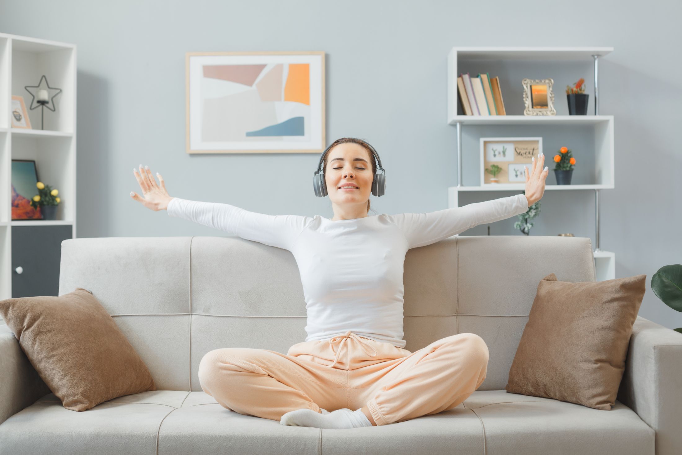young-beautiful-woman-home-clothes-sitting-couch-home-interior-with-headphones-happy-positive-relaxing-spending-weekend-home.jpg