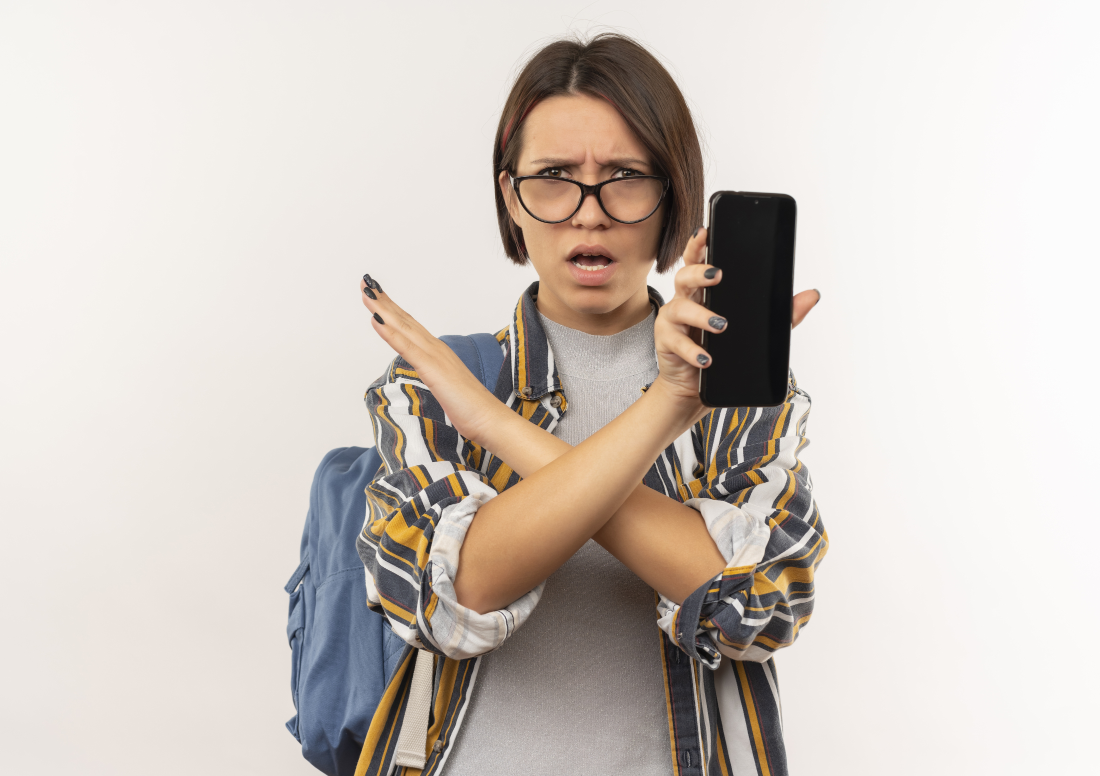 unpleased-young-student-girl-wearing-glasses-back-bag-showing-mobile-phone-doing-no-gesture-side-isolated-white-background-with-copy-space.jpg